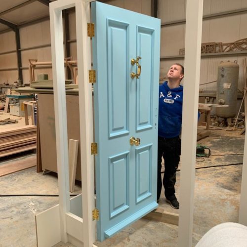 Joiner Inspecting a Door and Frame